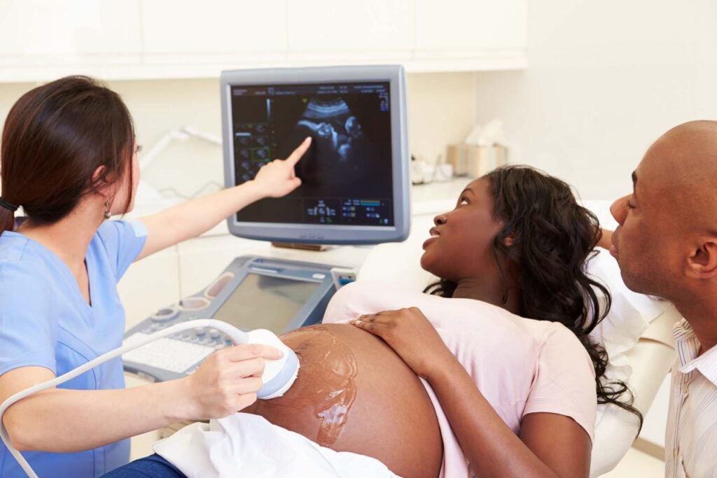 Photograph of Pregnant woman having an Ultrasound Scan